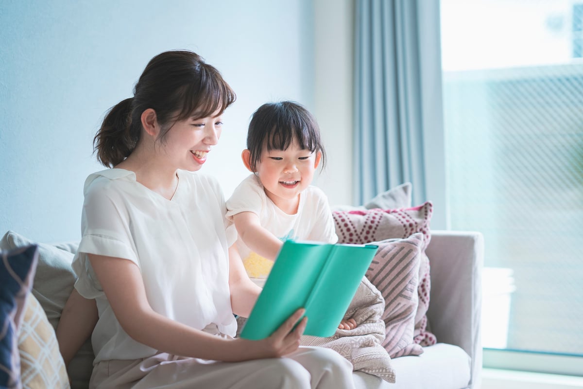 Mother and daughter reading a picture book